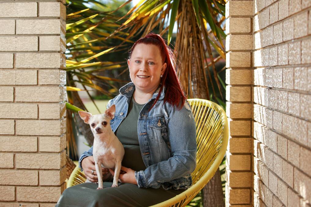 Life-changing: Albion Park woman Caitlin McKay, pictured with her dog Chloe, is studying nursing to give back to the medical profession which has helped her through two organ donations. Picture: Adam McLean