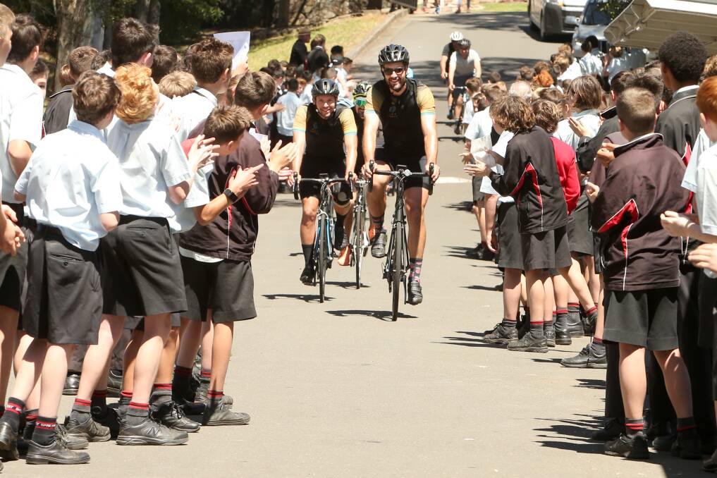 Edmund Rice College students cheered on Ryan Fowler and Lee Morley and the other participants in Rio's Ride. Picture: Sylvia Liber