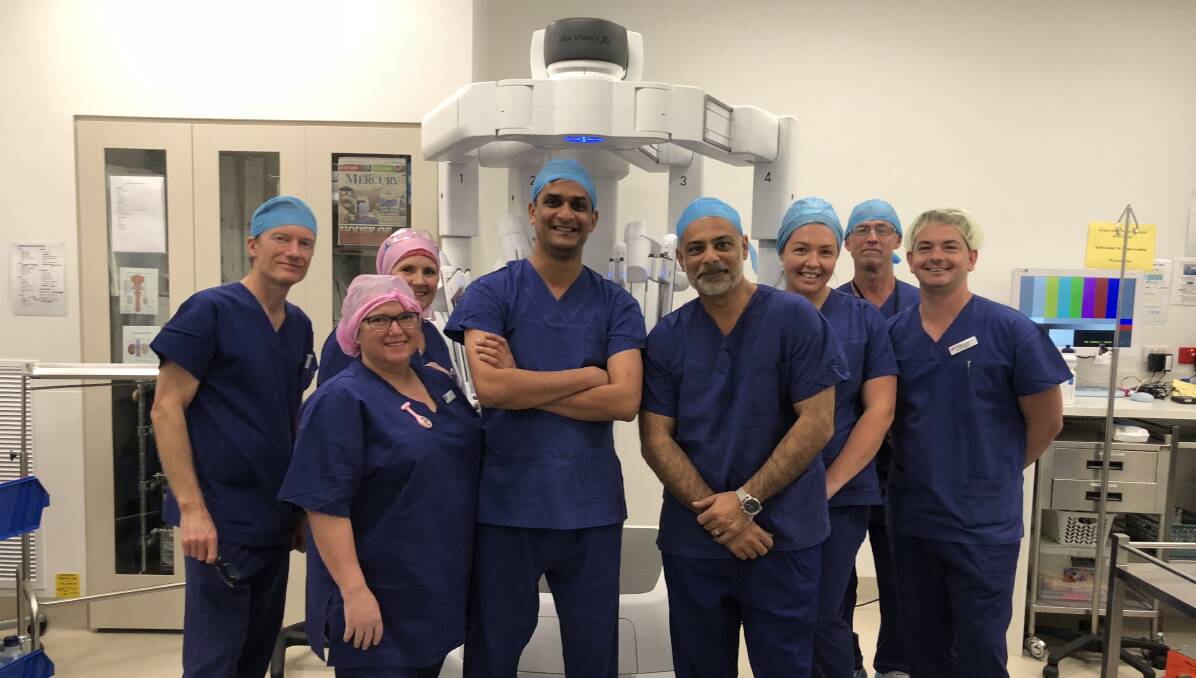 Wollongong gynaecologist Dr Dharmesh Kothari and his team with the da Vinci Xi surgical system at Wollongong Private Hospital.