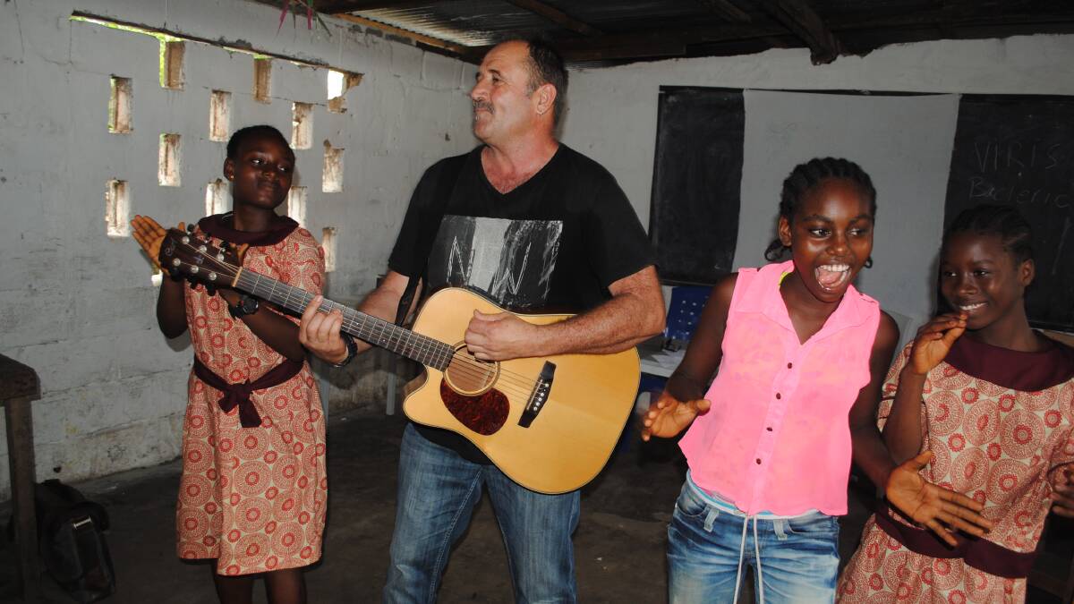 Song and dance: Illawarra drug and alcohol worker, and musician, Mick Fernandez was so inspired by the trip he penned a song, Beautiful Liberia.