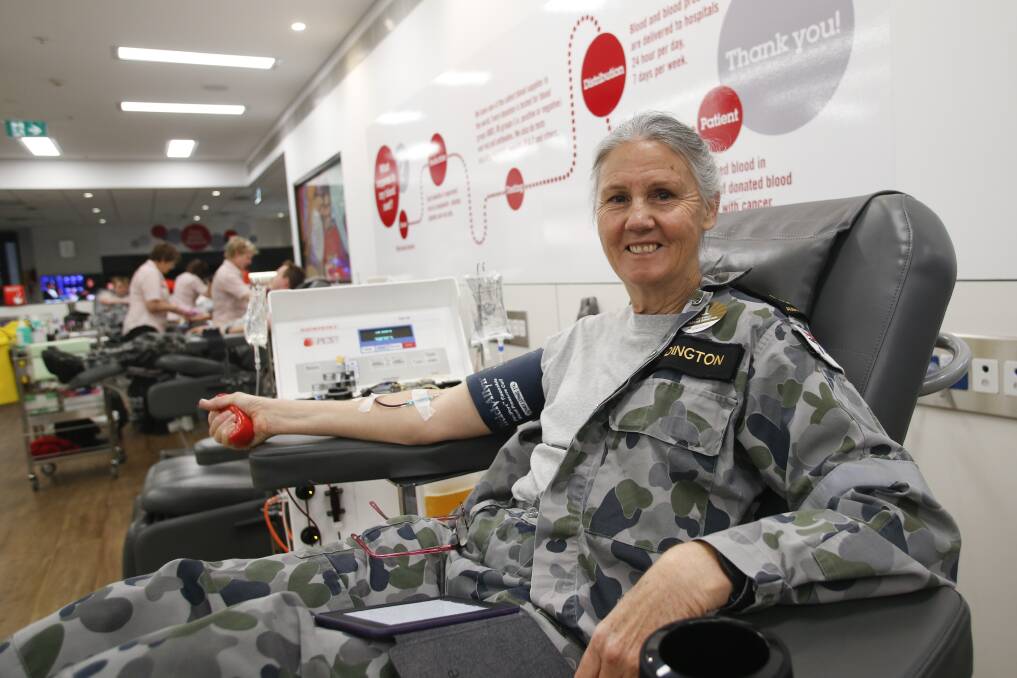 Saving lives: Regular blood donor Linda Eddington from HMAS Albatross again rolls up her sleeves on Monday as part of the annual Defence Blood Challenge. Picture: Anna Warr