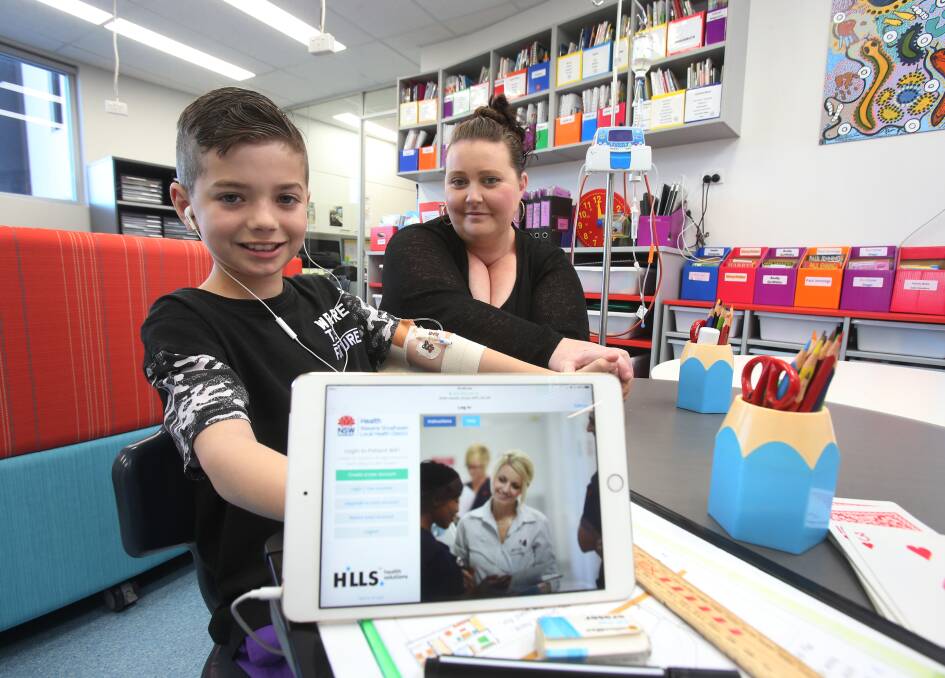Staying connected: Jye Healey and his mum Jessie-Lee have welcomed the introduction of free WiFi at the hospital. Picture: Robert Peet