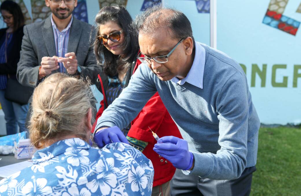 Shot in the arm: Martyn, 55, who lives at a boarding house for men in the city, was one of those able to take advantage of the free vaccine administered by Dr Hitesh Shah on Saturday morning. Picture: Adam McLean