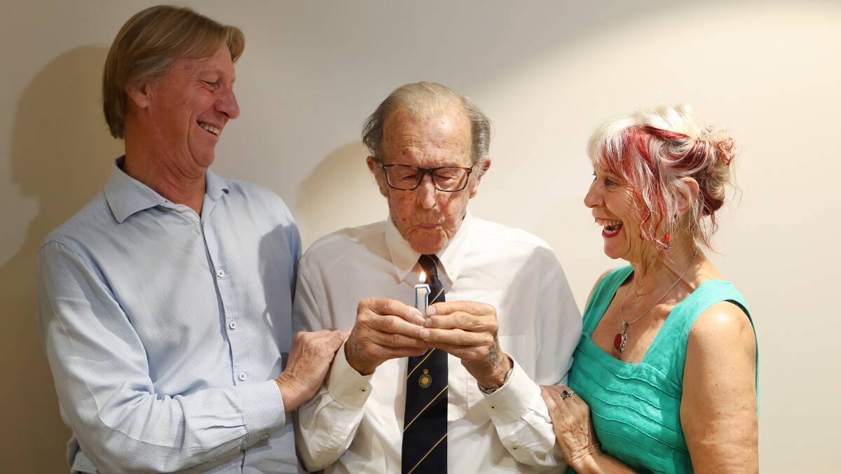 Norm Rowland, a founder of Warrigal, celebrates his 100th birthday, with son Neil and daughter Robyn. Picture: Sylvia Liber