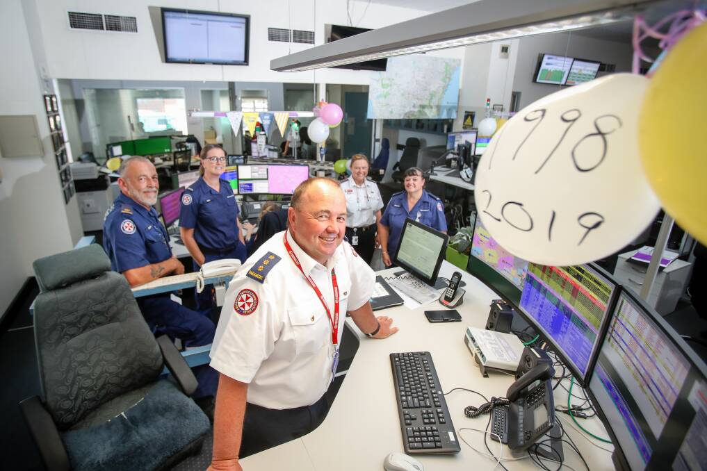Vital role: NSW Ambulance southern control centre supervisor Craig Packer (centre) with (back L-R) Inspector Norm Rees and call-takers Kim Sommers, Kim Tonkin and Janelle Gaskin celebrate International Control Centre Week. Picture: Adam McLean