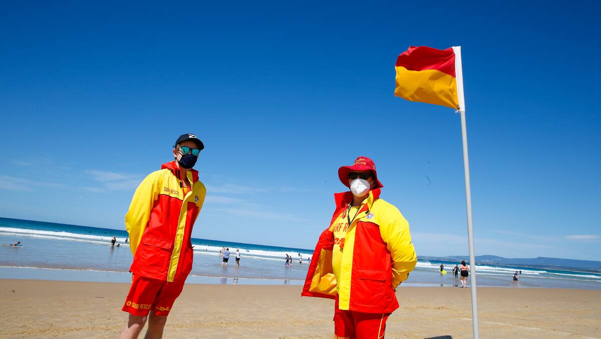 Helping hand: Riley Van Anen and Daren Weidner from Coledale Surf Life Saving Club on patrol at Port Kembla beach on Sunday. Picture: Anna Warr