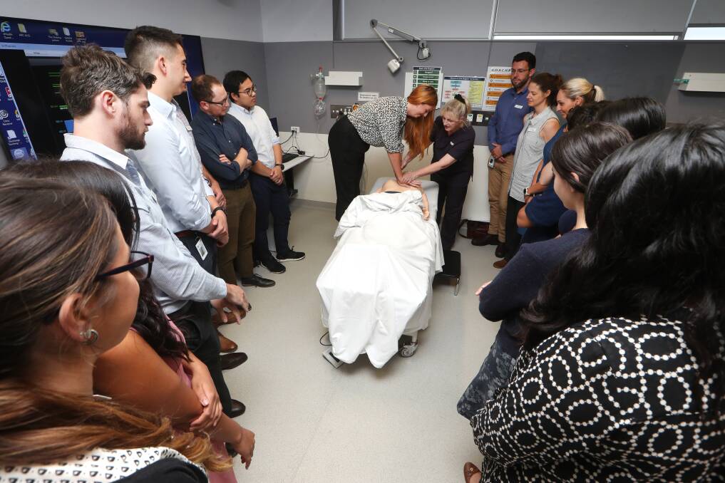 Life skills: Junior medical officer Meredith Grey practices CPR during a Basic Life Support session as her peers look on. Sixty-seven interns start across the district this week, 49 of them at Wollongong Hospital. Picture: Sylvia Liber