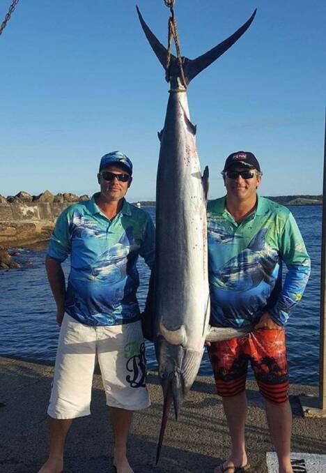  First catch: Dominic Paronetto (left) and Peter McDonald with Dom's first ever marlin from last weekend.