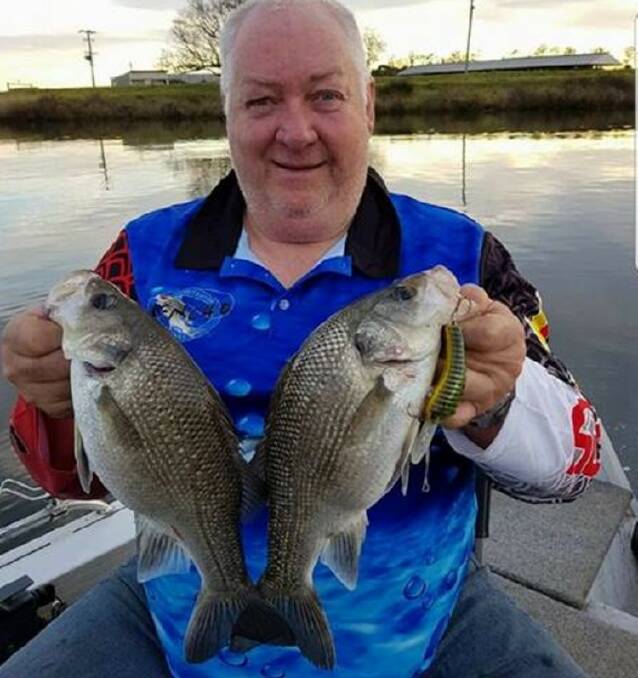 Darcy Menchin with a nice pair of Australian bass about to be released.