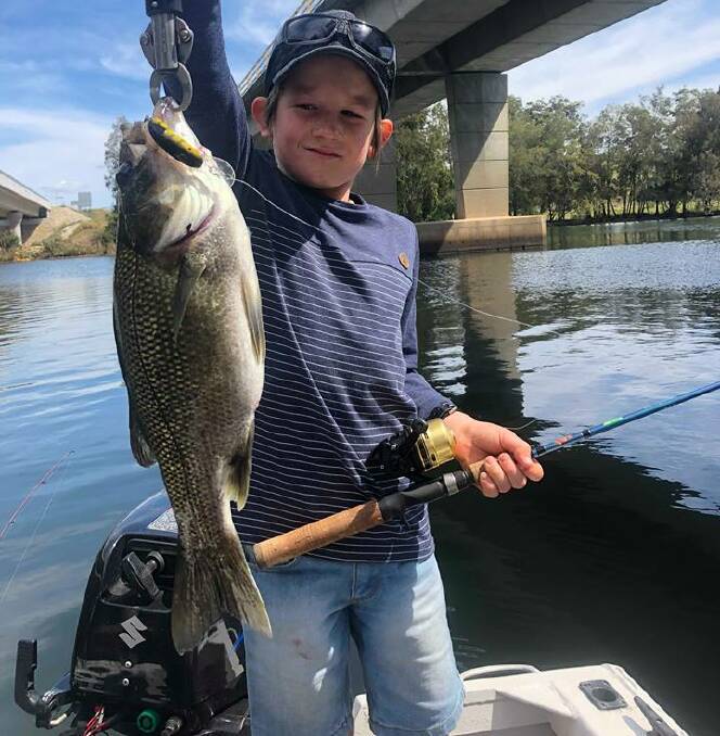 Highway to heaven: Young Adam Lamb shows his bass from a secluded estuary. (Photos submitted for publication should be high res - around 1MB is fine.)