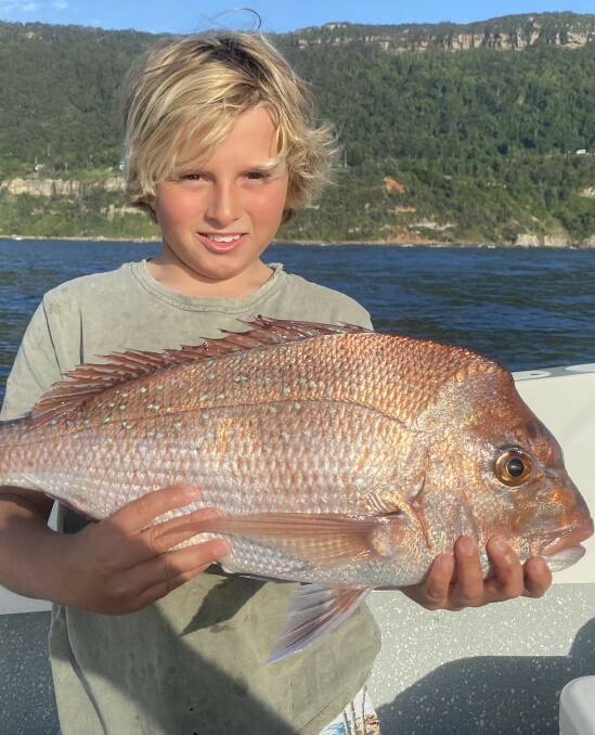Child's play, really: Ashton Mekisic with a northern reef snapper easily hitting the scales at over two kilograms.