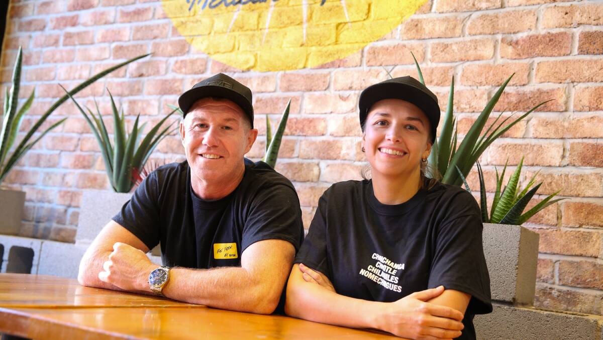 Hiring: Business owners Paul O'Neill and Gabi Antelmi at Guzman Y Gomez Wollongong where dozens of jobs are available. Picture: Anna Warr