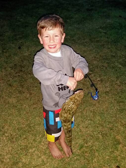 Nice catch: Lachlan Plumb, 4,  struggles to hold his Sussex Inlet flathead.