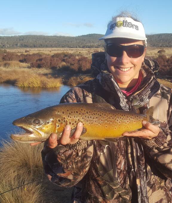 How now brown trout: Kim Stolk with a 1.5kg brown trout taken on the season close weekend last month.