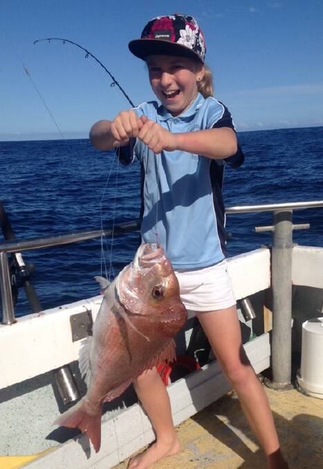 Well caught!: Sibeal McNamara with her 63cm snapper she caught on her dad's charter boat Argus.