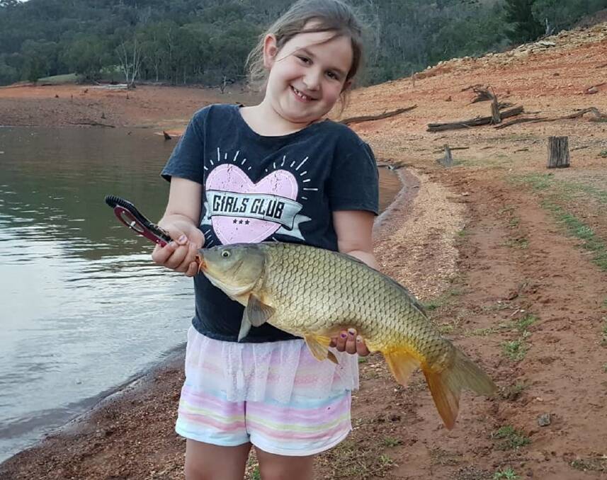 Girls rule: Mikaela Emms with her Burrinjuck Dam 3.9kg carp caught on a 2kg line that won her several divisions at a local comp last weekend.