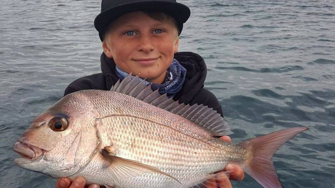 Great catch!: Ryan Skeen with a local snapper. The shallows around the Port Kembla area have been producing some good pan-sized snapper.