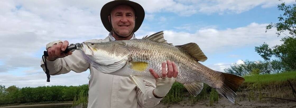 Irresistible: Rob Dunn with an excellent barra he caught on his own hand-made Tonk lure. (Email your high res fishing photos to gazwade@bigpond.com.)