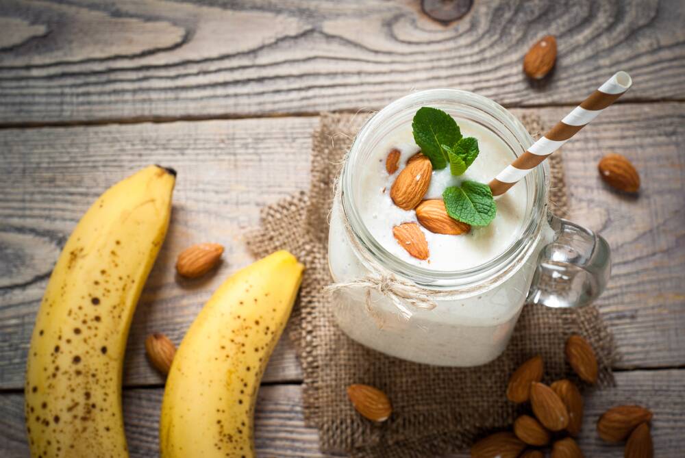 Healthy snacks: Bananas, almonds and yoghurt are among the many superfoods you can snack on instead of sugary, fatty treats.