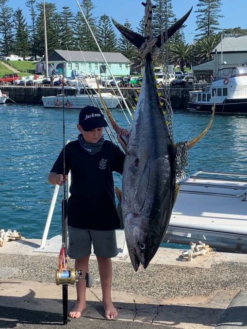 Excellent catch: Taj Newcombe and his 68.5kg yellowfin tuna caught on a 15kg line during last weekend's Kiama Game Fishing Club comp. 