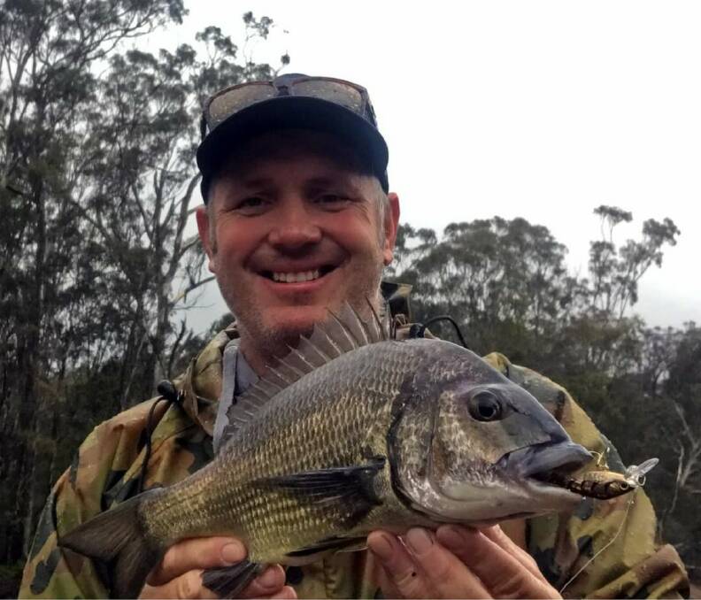 Home-made does the trick: Jason Davies with a bronze-coloured bream caught on his home-made lure.