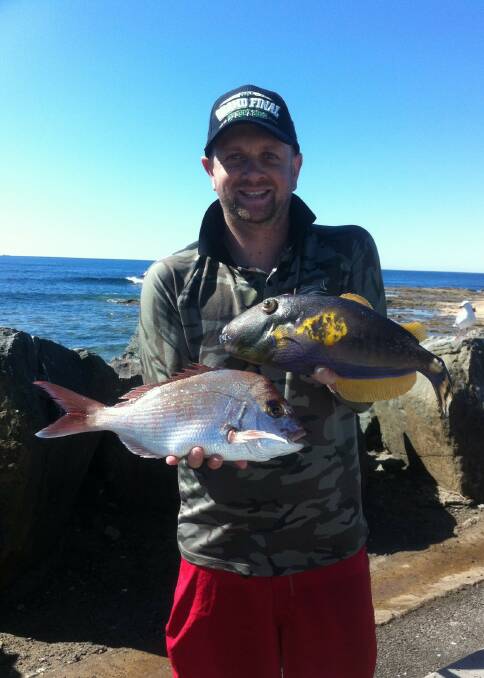 Dinner double: Peter King from Penrith scored this reddie and leatherjacket off Bellambi.