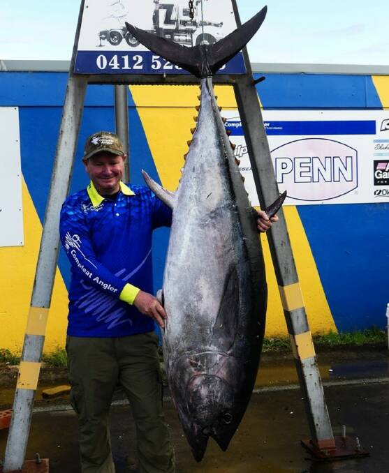 Blue heaven: Grant Hartley stands alongside his recent 112 kilo southern bluefin tuna. The best fish are being caught further south.