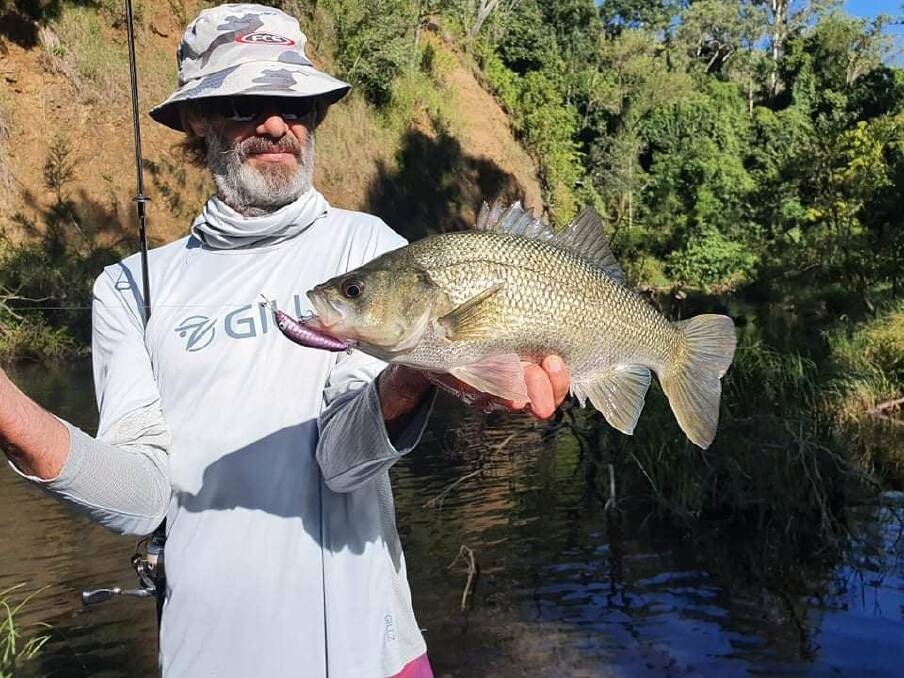 Dodged a bullet: Brad Howard with a beast of a bass that was quickly released.
