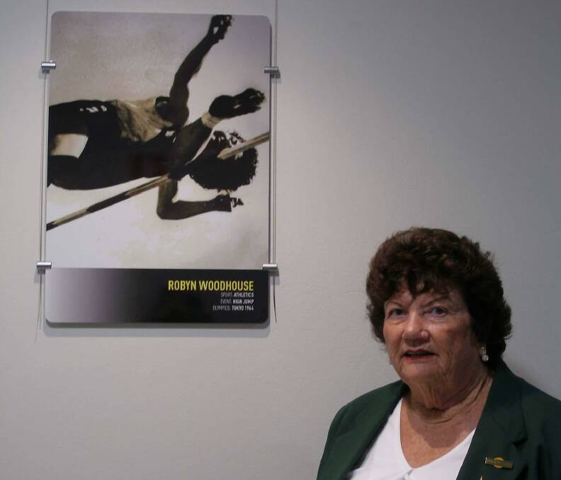 High flyer: 1964 Tokyo Olympian Robyn Woodhouse-Sillitoe, who used an unusual high jumping style to become one of the best in the world, reflects on her achievements with her photo on display at Beaton Park.