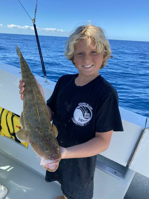 Leaping lizards: Keen, young fisherman Ashton Mekisic with his impressive Northern Beaches flathead.