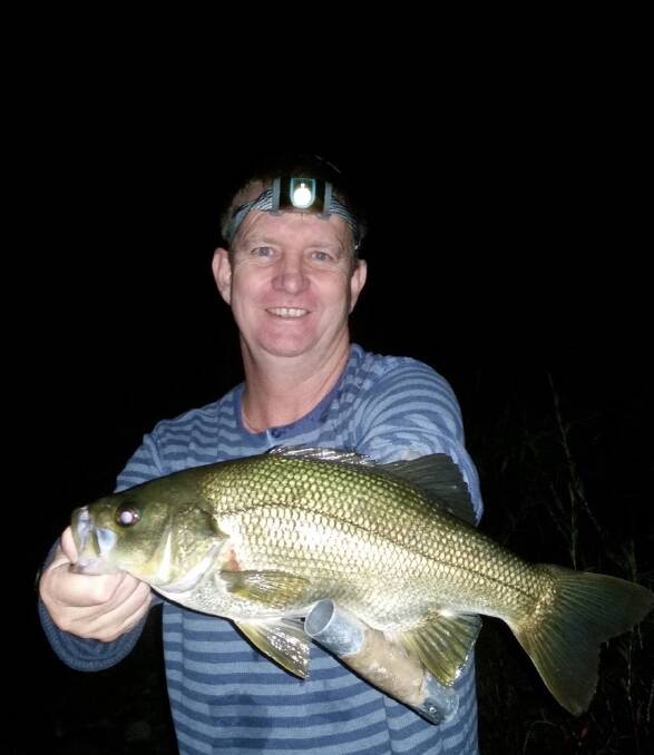 Jason Goodson fished into the evening for this solid bass that he released.