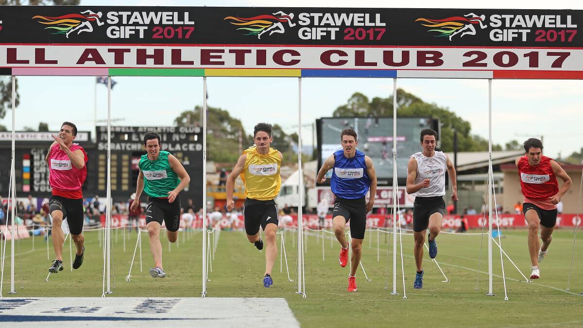 Kyle Grubnic (in blue) finishes third in the 2017 Stawell Gift. The race was won by Matthew Rizzo (yellow). Picture: Scott Barbour.