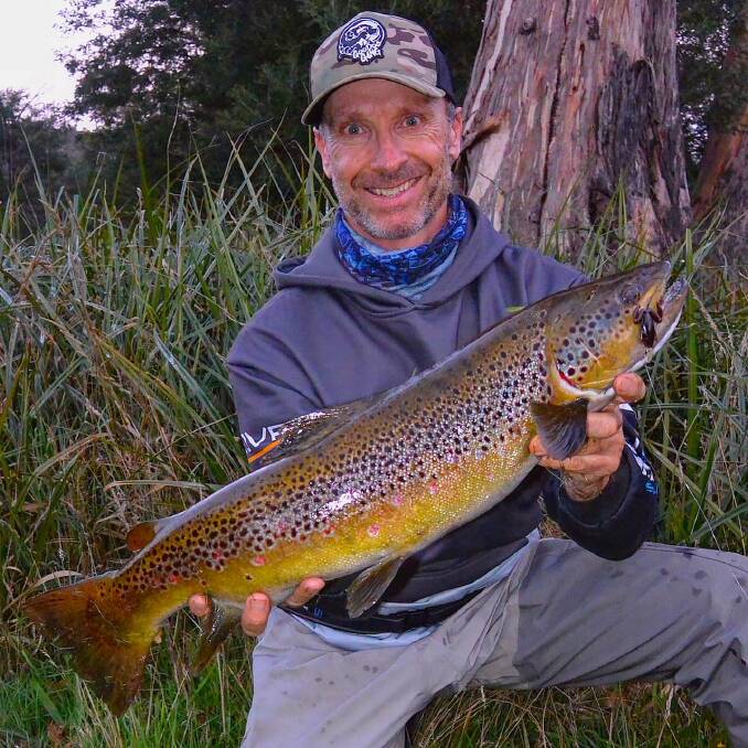Brown beauty: Andrew McGovern with an excellent spawning run brown trout from Eucumbene River before the closure.
