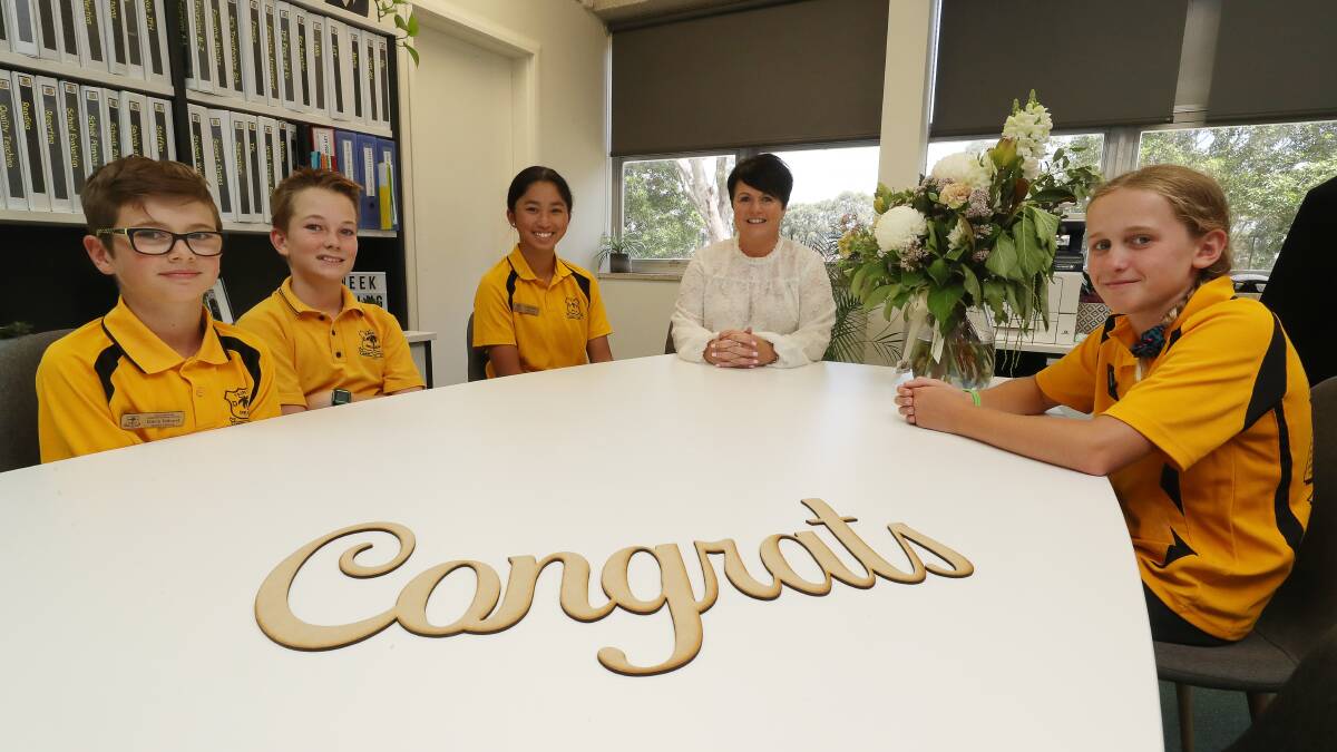 DOUBLE SUCCESS: Fairy Meadow Demonstration School principal Alison Rourke with students Darcy Tolhurst, Toby Millar, Mia Luu and Eden Neich. The school was recently named Primary School of the Year/ Government sector. Picture: Robert Peet
