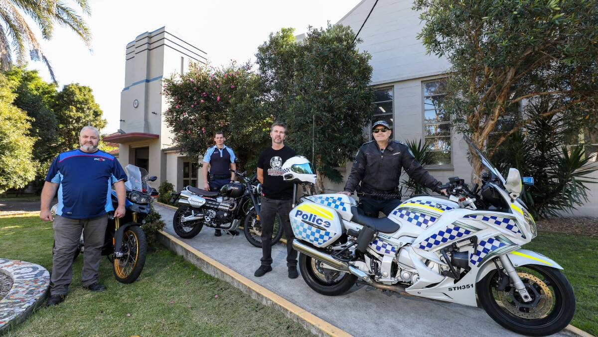 SOLACE GARAGE: Wollongong PCYC sector manager Mark Mleczko, Sergeant Youth Command David Stewart, Timothy Sim and Snr Constable Phil Roddy. Picture: Adam McLean