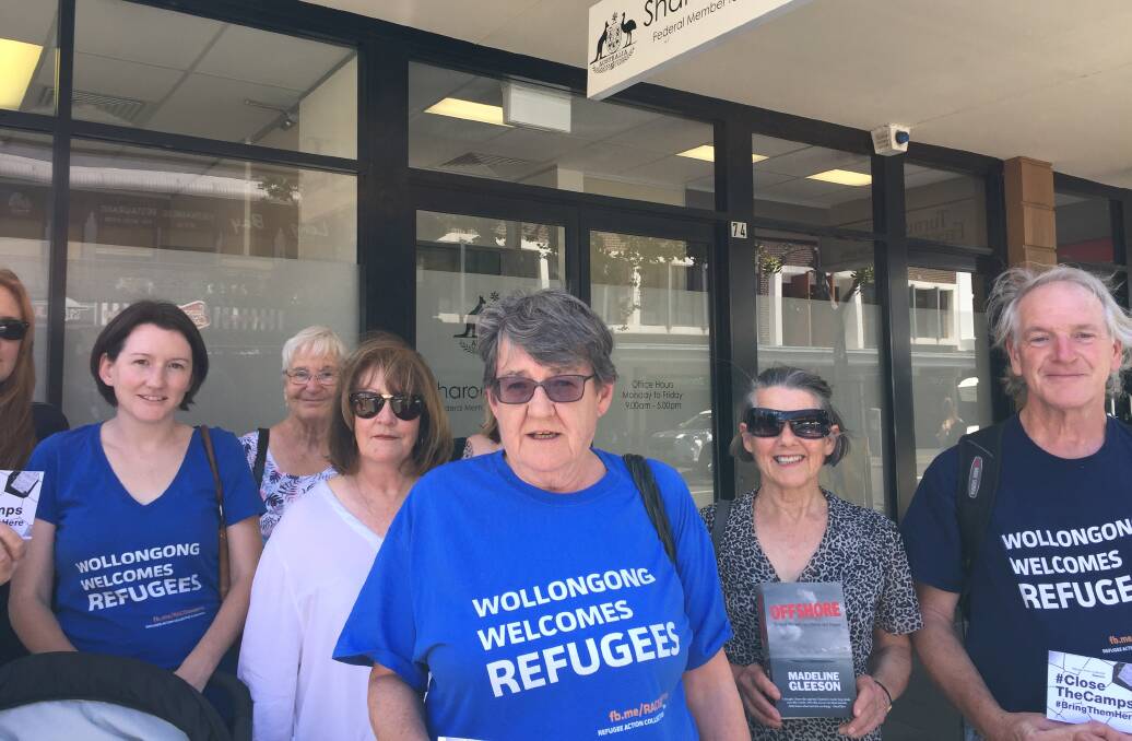 SHOW OF SUPPORT: Refugee Action Collective Illawarra spokesperson Dr Marg Perrott (centre) and other members will hold stalls for Refugee Week.  