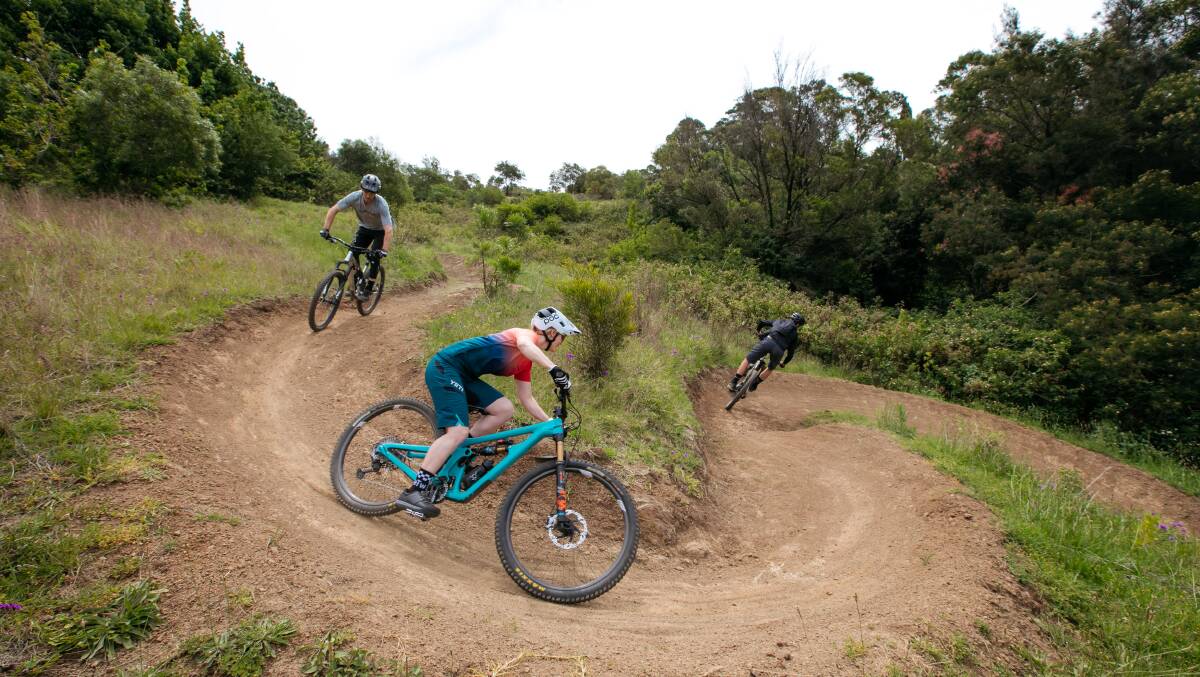 FLYING AROUND: Darcy Coutts and Leanna Curtis ride on Cringila Hills Recreation Park's mountain bike trails. Picture: Wesley Lonergan.