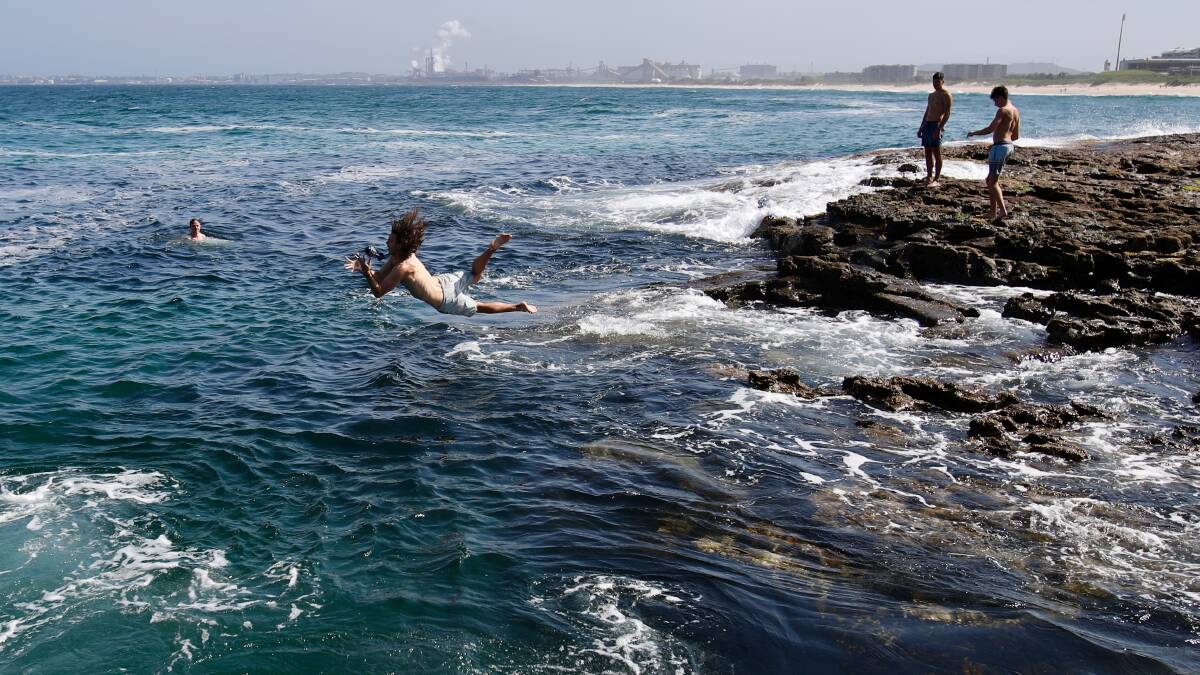 KEEPING COOL: Teenagers cool off in the ocean at Flagstaff Point near City Beach on Tuesday. Picture: Adam McLean.