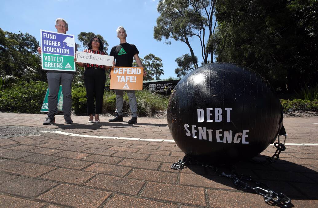 TIME TO END DEBT SENTENCE: Greens federal candidate for Cunningham, Rowan Huxtable and state candidate for Wollongong, Benjamin Arcioni flank Greens Senator Mehreen Faruqi. Picture: Robert Peet. 