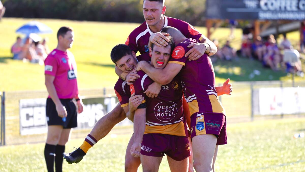 Shellharbour Sharks players celebrate after Braxton Wallace crosses for a try. Picture by Anna Warr