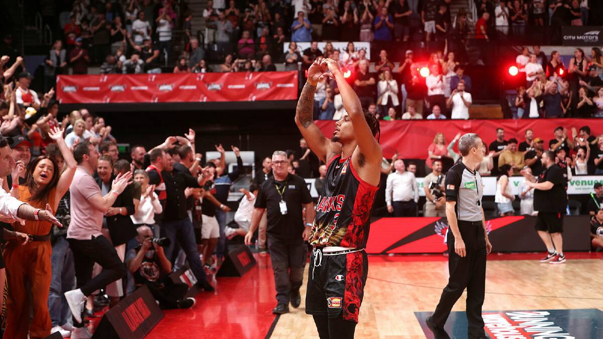 Justin Robinson shows some love to Illawarra Hawks fans. The Hawks return to WIN Entertainment Centre on Sunday, March 10 needing to beat Melbourne United to keep their semi-final series alive. Picture by Sylvia Liber