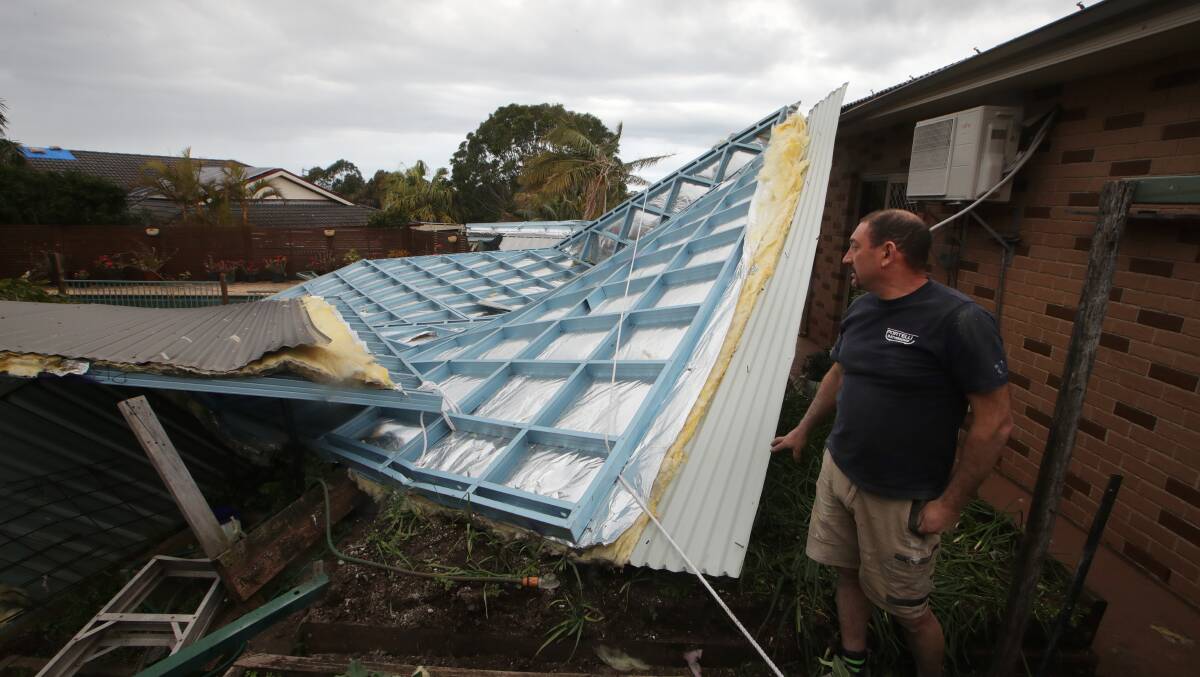 EXTENSIVE: Anthony Portelli surveys the extensive damage the storm inflicted on his parents' Flinders house. Picture: Sylvia Liber