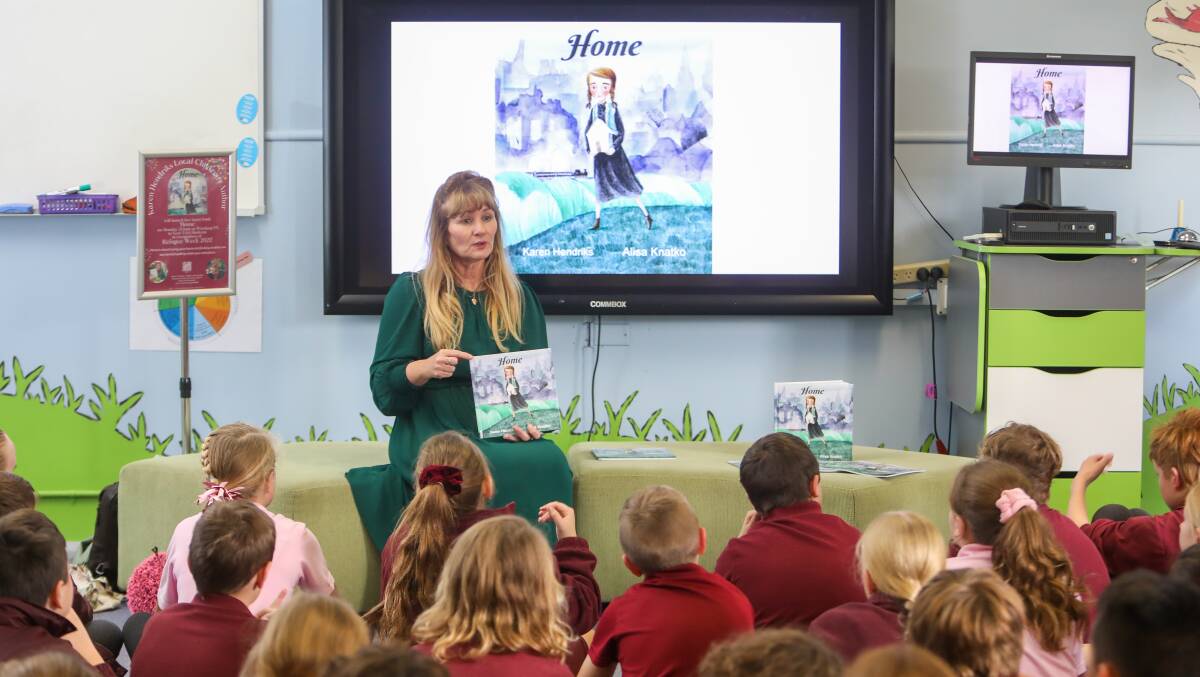 BOOK LAUNCH: Shellharbour author Karen Hendriks launched her children's book Home at Windang Public School on Monday to coincide with Refugee Week (June 20-26). Picture: Adam McLean