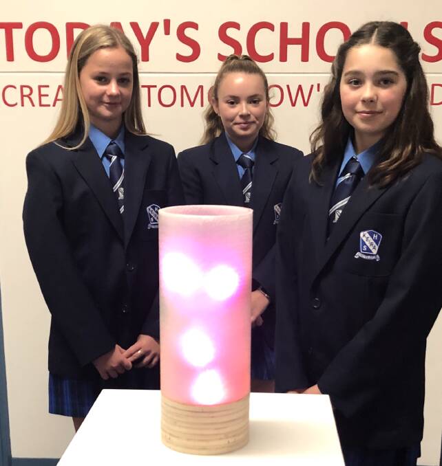 ENTREPRENEURIAL TEENS: Illawarra high school students Piper Gillen, Molly Rigby and Hallie Reid created the Link Lamp to to connect people and reduce loneliness.