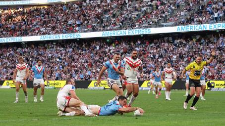 Sydney Roosters lock Nat Butcher crosses for a try during their Anzac Day clash against St George Illawarra Dragons at Allianz Stadium. Picture by Cameron Spencer/Getty Images