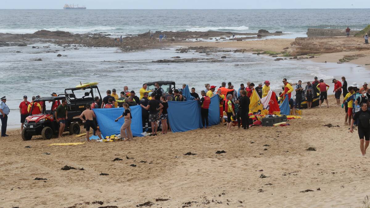 Surf life savers, emergency personnel and surfers and swimmers worked hand in hand to rescue people after a boat capsized off Waniora Point, Bulli. Picture: Robert Peet