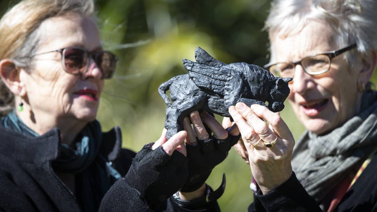 DONATION: UOW alumna Jules McCue and UOW Art Collection director Senior Professor Amanda Lawson check out the Winged Bull. Picture: Paul Jones