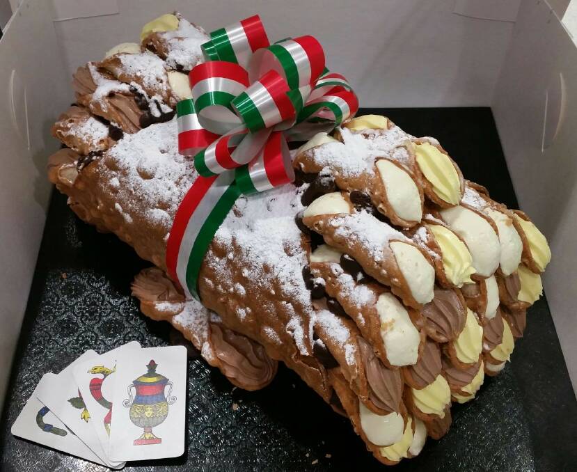 HOLY MOLY: This giant 'Bazooka Cannoli' can be purchased from Pasticceria Caruso in Stockland Shellharbour.