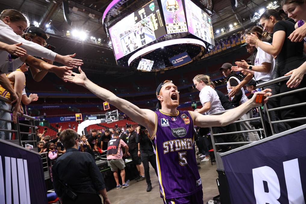 YEAH BABY: Angus Glover celebrates with the crowd after the Sydney Kings clinched the Grand Final aeries victory on Wednesday night. Picture: Getty