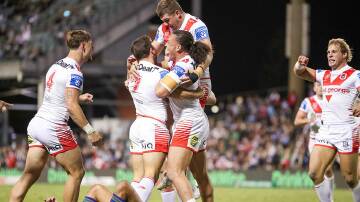 St George Illawarra players celebrate after scoring a try against the Warriors at WIN Stadium on Friday, April 19, 2024. Picture by Adam McLean